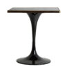 Mesa bar Than de estilo art deco fabricado en mármol sintético en color negro con acabado brillo combinado con acero en color oro y hierro. Piedra de granito con acabado mármol. Producto desmontable.