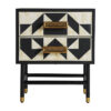 Mesita de noche senj de estilo art deco fabricado en hierro en color negro combinado con hueso en color blanco.