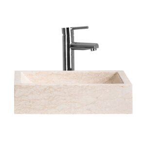 Lavabo Haumea de estilo contemporáneo fabricado en piedra en color marfil.