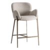 Taburete Uelzen de estilo contemporáneo fabricado en algodón en color gris combinado con hierro en color oro con acabado cepillado.
