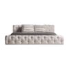 Cama Santorini de estilo provenzal fabricado en tela en color beige combinado con madera de pino y espuma.