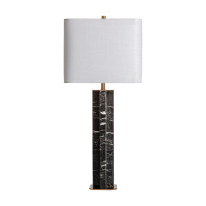Lámpara de sobremesa de estilo art deco fabricado en mármol en color negro combinado con hierro en color oro y poliéster en color blanco. Producto desmontable.
