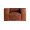 Sillón Kurza de estilo vintage fabricado en madera de abeto en color marrón combinado con cuero y espuma. Producto desmontable.